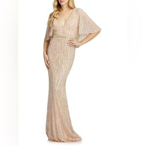 Mac Duggal - Capelet Sequin Sheath Gown
Size 6
Porcelain